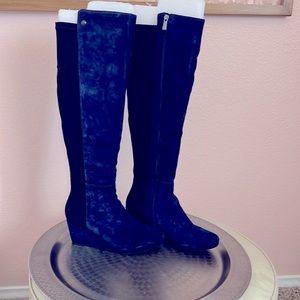 Blue suede knee high boot. Suede in front, black neoprene in back for stretch.